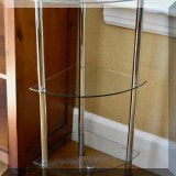 F45. Metal and glass corner shelf. 